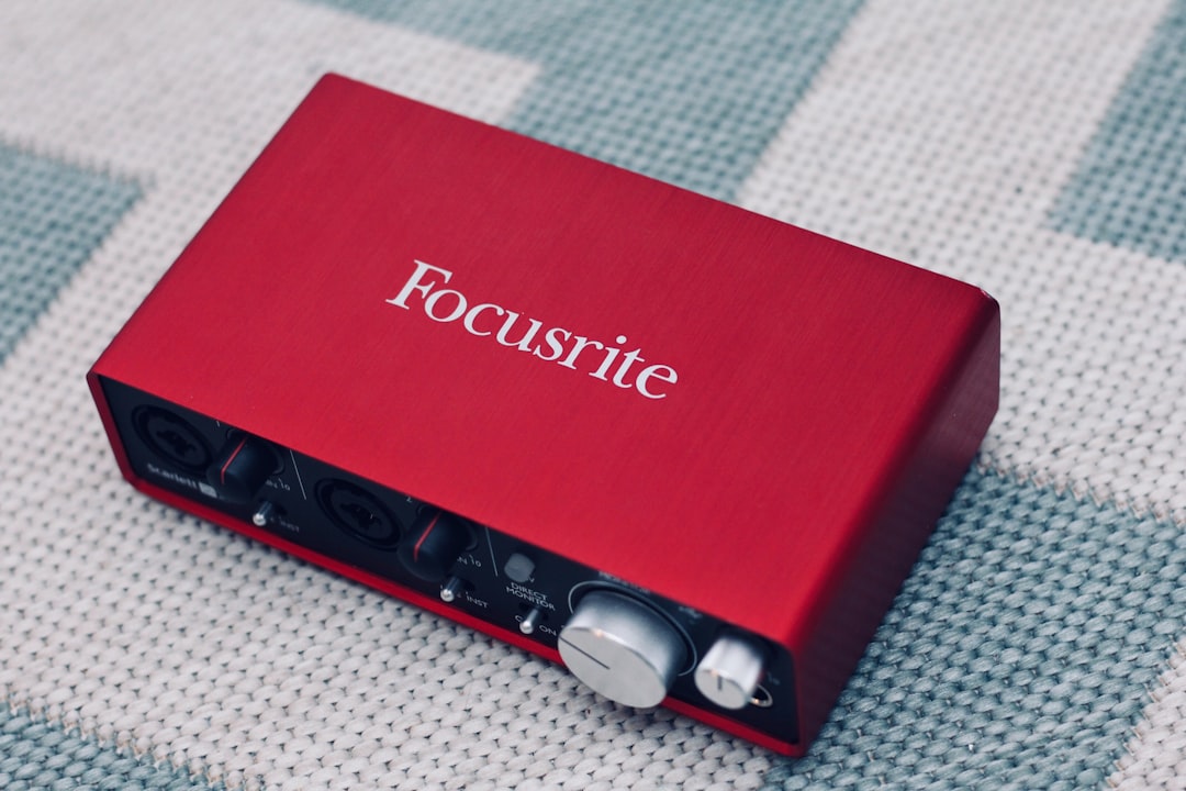 Audio interface and USB microphone side by side in a professional voice over studio setup