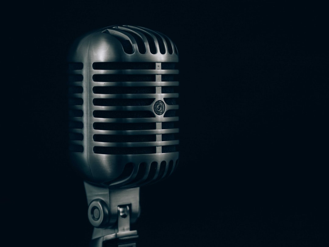 Professional voice over studio with acoustic treatment panels showing room treatment beats microphone upgrade